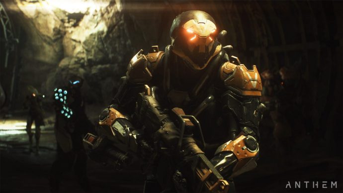 Three exosuits patrolling a cave.