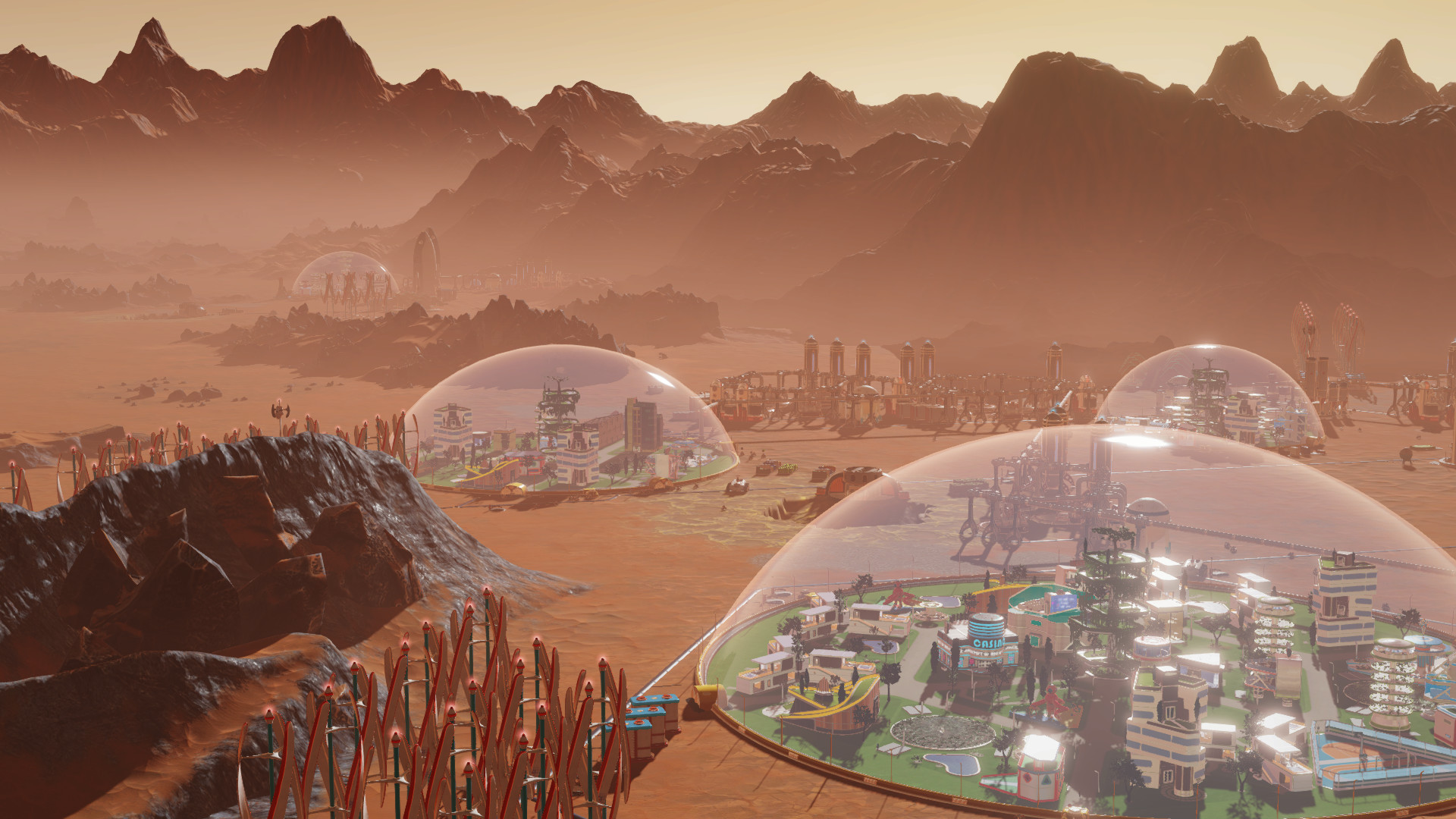 A screenshot showing four bubble colonies on the surface of Mars in Surviving Mars.