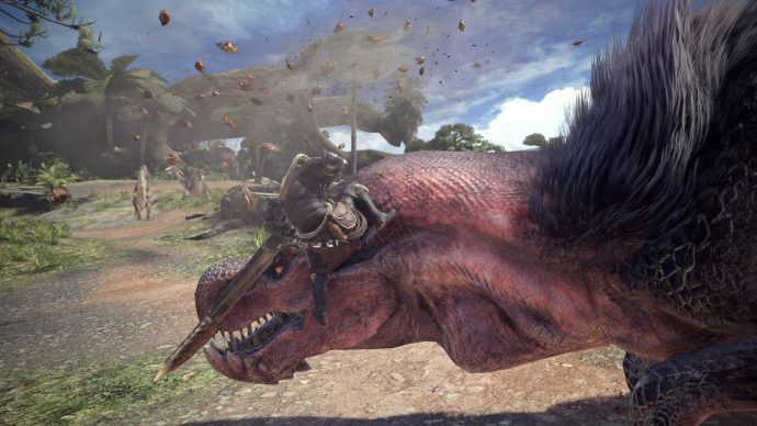 A screenshot of a character tackling one of the huge dinosaur creates in Monster Hunter: World.