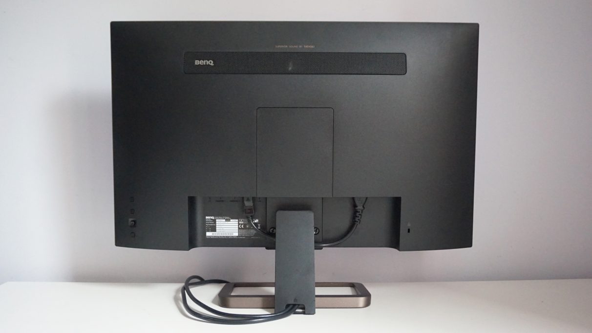 A rear image of the BenQ EX2780Q monitor showing its fixed stand and rear control panel.