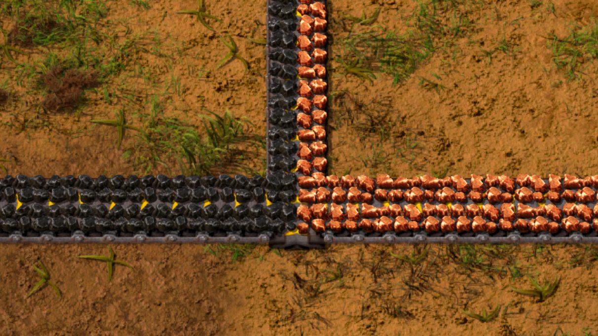 An example of how you can transport multiple item types on a single belt in Factorio.