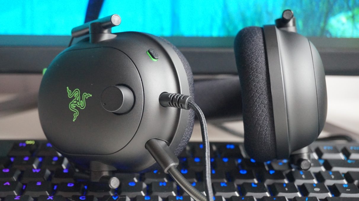 A close up photo of the Razer Blackshark V2's volume wheel and microphone mute button.