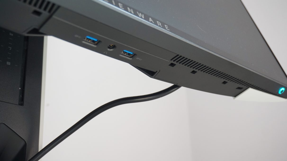 A photo showing two of the Alienware AW2521HFL's USB 3.0 ports and the headphone jack on the lower bezel of the main screen.