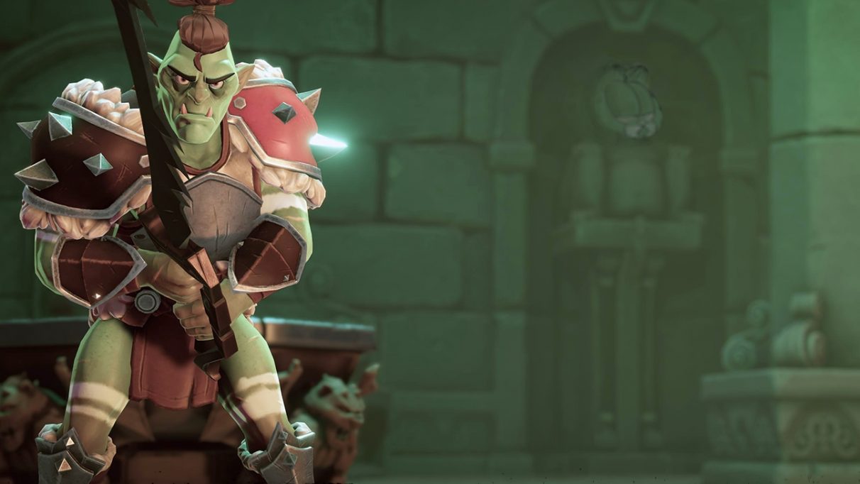 An orc looks menacing on a loading screen. Faintly visible in the background, a suit of armour has Garfield's revolting face