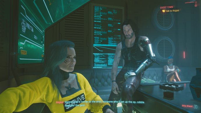 A nightclub scene in Cyberpunk 2077, in which a character named Rogue is speaking to the player while a glowing, holographic cyber Keanu Reeves stares daggers at Rogue.