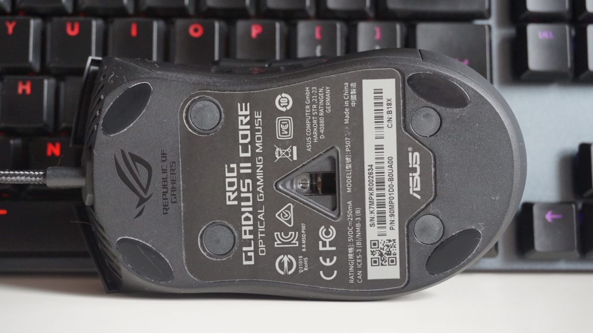 A photo showing the bottom of the Asus ROG Gladius II Core gaming mouse.